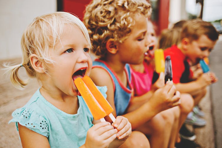 group of kids eat icypoles