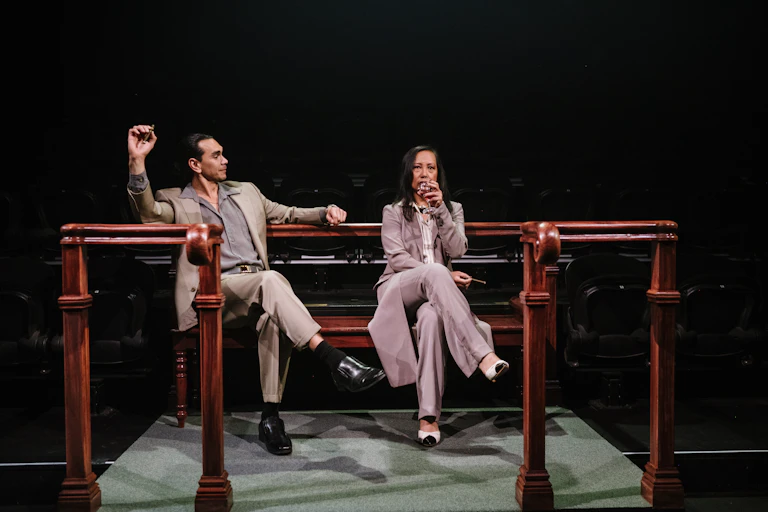 Two people in beige suits