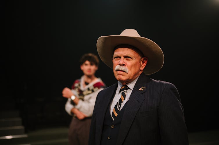 A man in a broad brimmed hat.