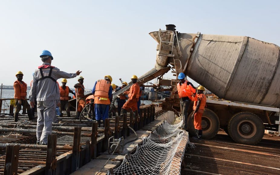 Men working at a port construction site.