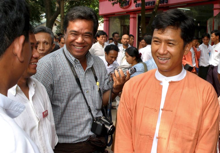 88 Generation student leader Kyaw Min Yu, also known as Ko Jimmy (R), with National League for Democracy (NLD) members in Yangon in 2006.