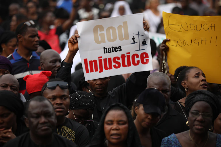A group of people carrying placards