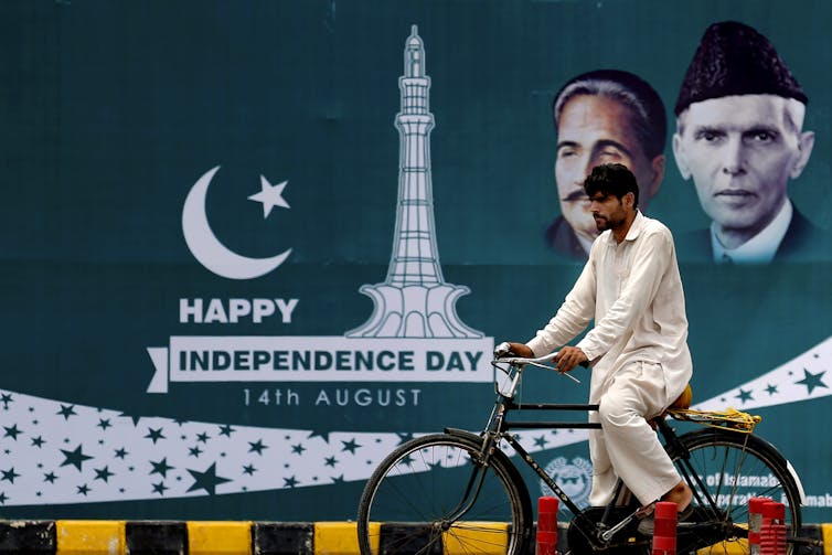 A Happy Independence Day billboard with images of founder leader Mohammad Ali Jinnah.