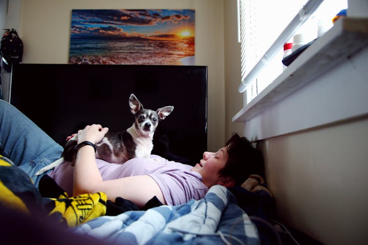 Woman on floor with dog