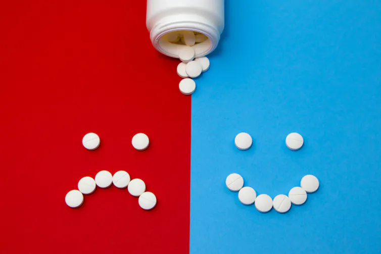 Pills in shape of happy and sad faces