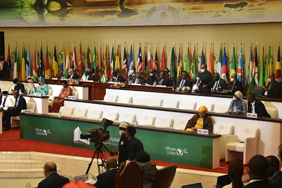 Men and women sit with their backs to numerous of African countries. 