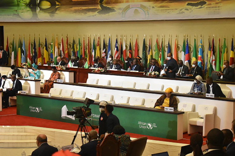 Men and women sit with their backs to numerous of African countries.