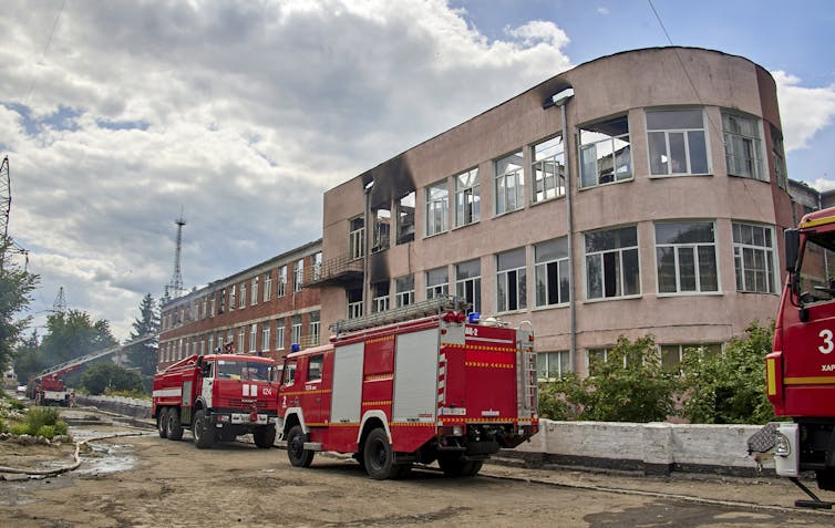 Fire engines outside of a shelled building in Kharkiv, Ukraine