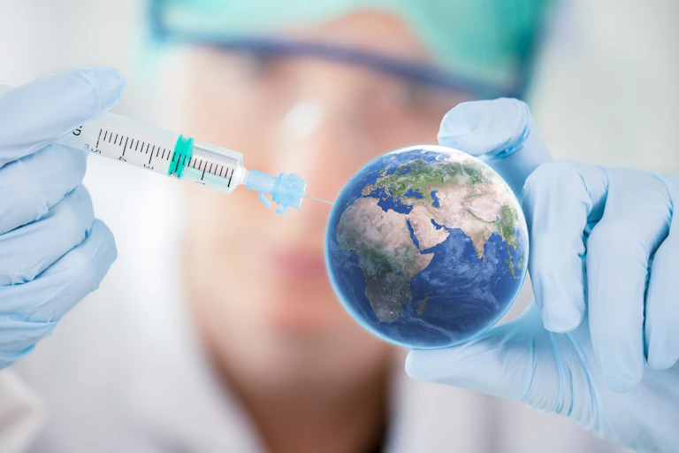 Syringe injecting model of Earth.