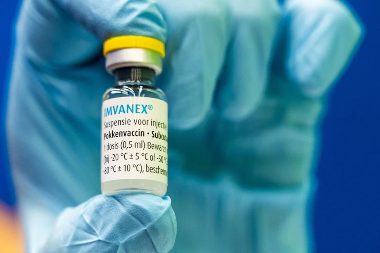 Close up of hand holding vaccine dose