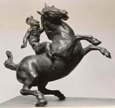 bronze sculpture of a rearing horse with a Greek warrior mounted on its back