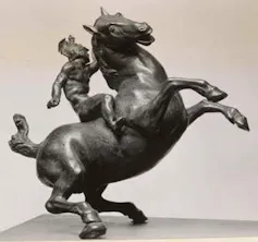 bronze sculpture of a rearing horse with a Greek warrior mounted on its back