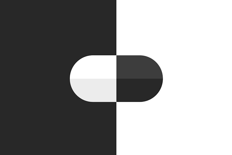 Illustration of black and white pill against black and white background