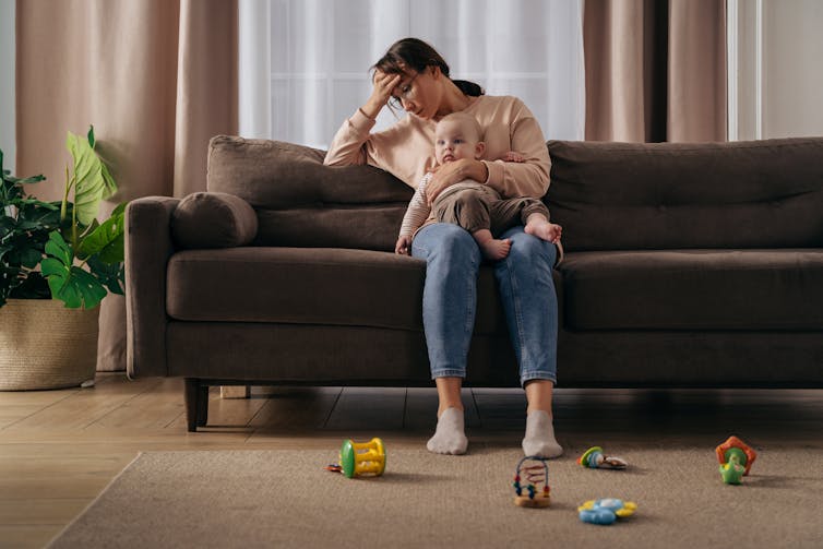 Mother with baby looking despairing