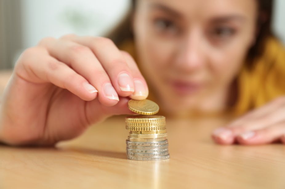 Woman stacking coins
