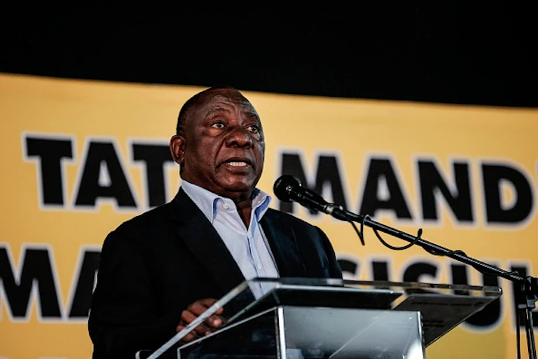 Man standing in front of a microphone at a podium
