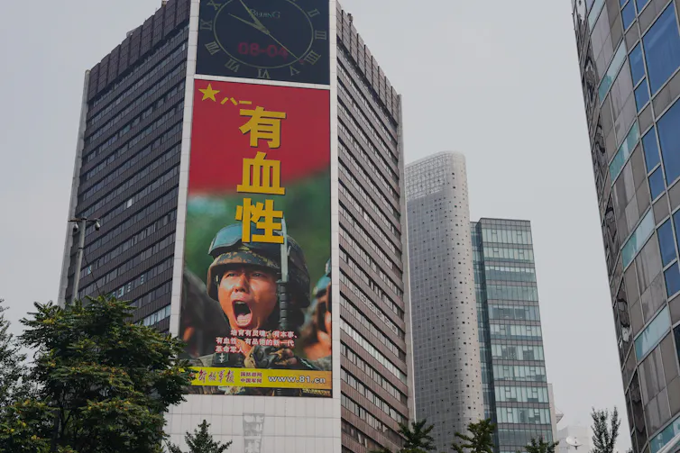 A military advertisement marking the 95th founding anniversary of the People's Liberation Army (PLA) is displayed at an office building in Beijing, China, 04 August 2022.