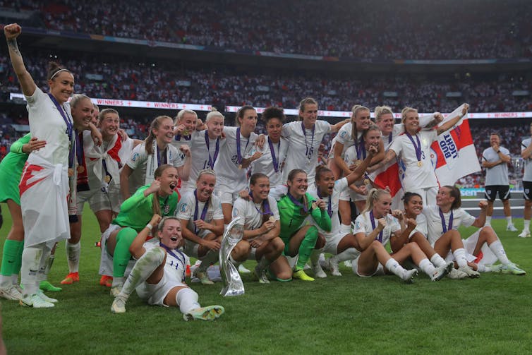 The England women's team celebrate their victory at Euro 2022.