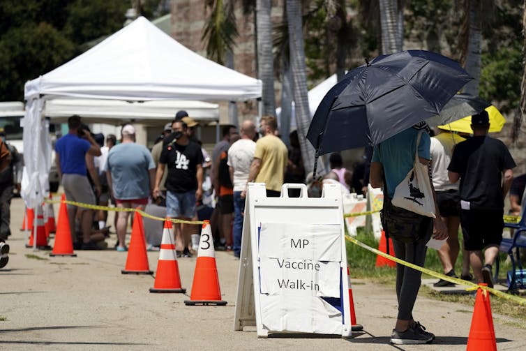 People lining up for monkeypox vaccines.