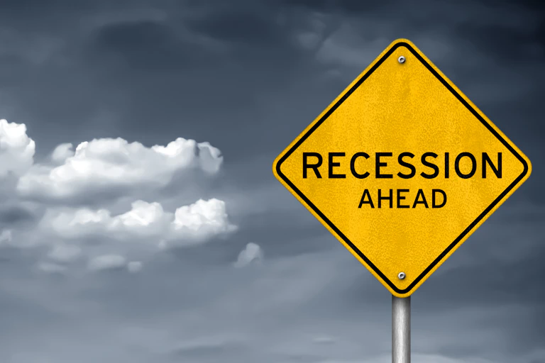 A road sign that says 'Recession Ahead' on it