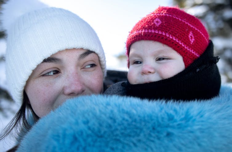 An Inuit woman with her daughter.