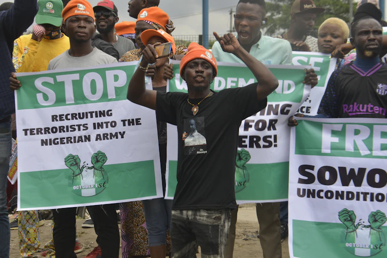 People carrying banners in protest