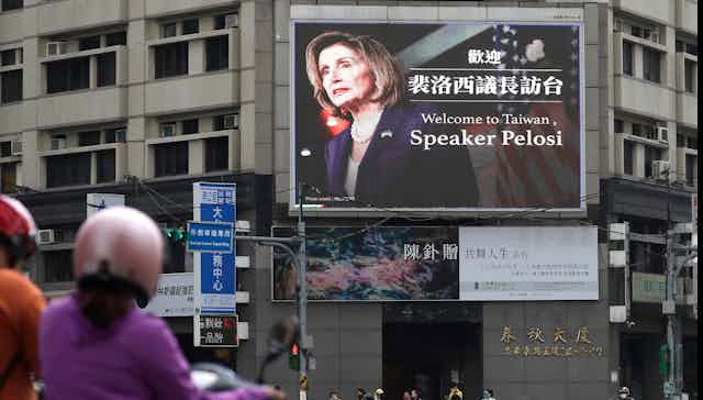 A billboard on a busy street features Nancy Pelosi's face and welcomes her to Taiwan.
