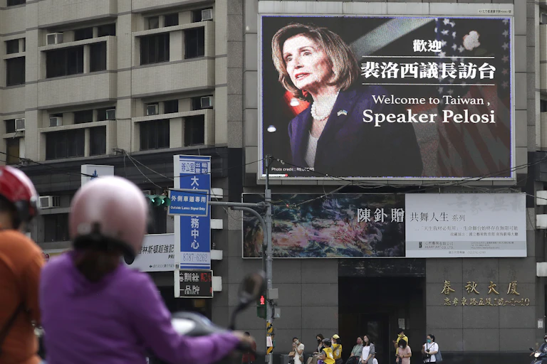 A billboard on a busy street features Nancy Pelosi's face and welcomes her to Taiwan.