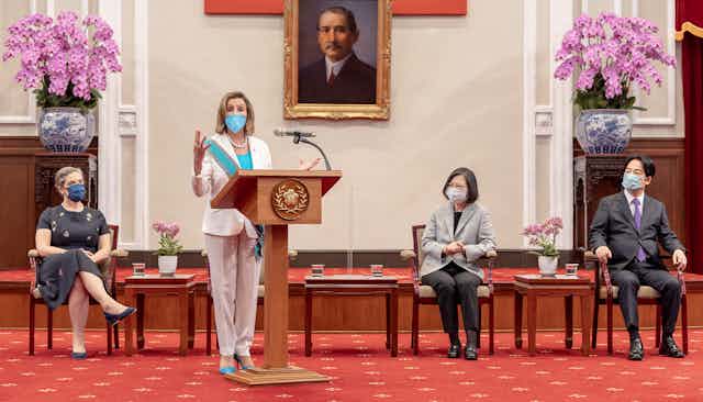 US house speaker, Nancy Pelosi, delivers a speech as Taiwan President Tsai Ing-wen looks on at the Presidential Palace in Taipei, Taiwan