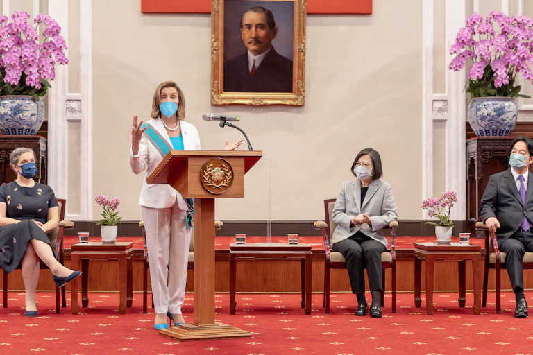 US house speaker, Nancy Pelosi, delivers a speech as Taiwan President Tsai Ing-wen looks on at the Presidential Palace in Taipei, Taiwan