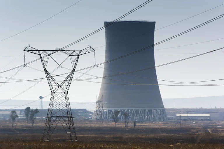 Cooling tower, pylon and overhead cables in landscape
