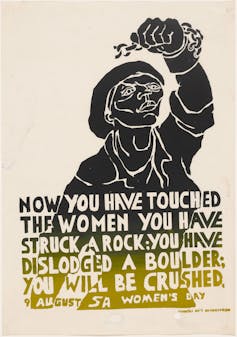 An illustration of a woman with a raised fist, handcuffs broken, and the words 'Now you have touched the women you have struck a rock. You have dislodged a boulder; you will be crushed.'