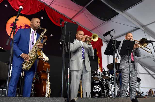 Three musicians performing at jazz festival