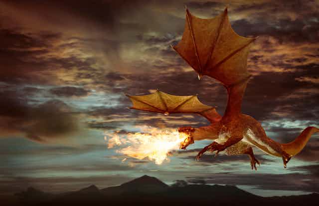 Fire-breathing dragon flies through twilight sky.