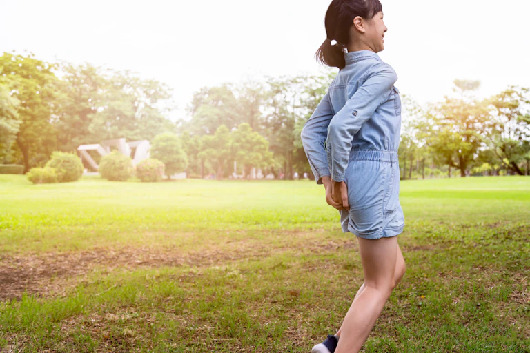 Girl holding bottom