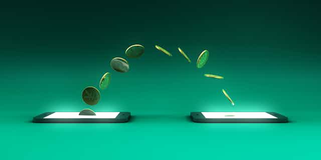 an arc of coins move between two cellphones
