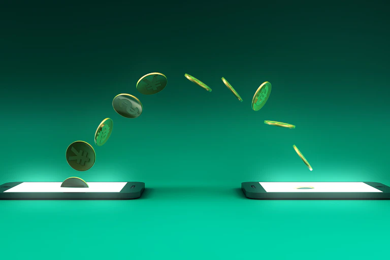 an arc of coins move between two cellphones