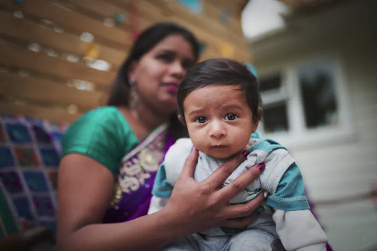 An Indian woman with her child