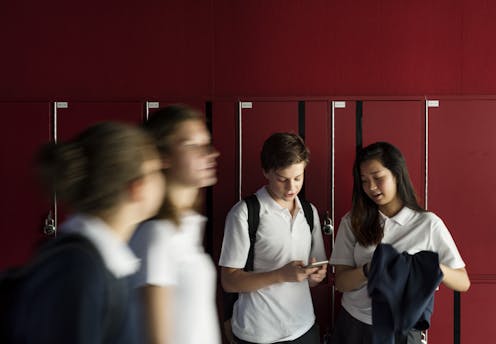 Another school has banned mobile phones but research shows bans don't stop bullying or improve student grades