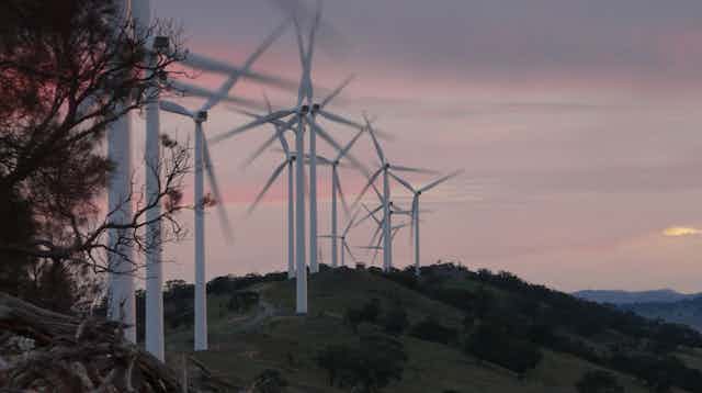 Wind turbines on a hill at subset 