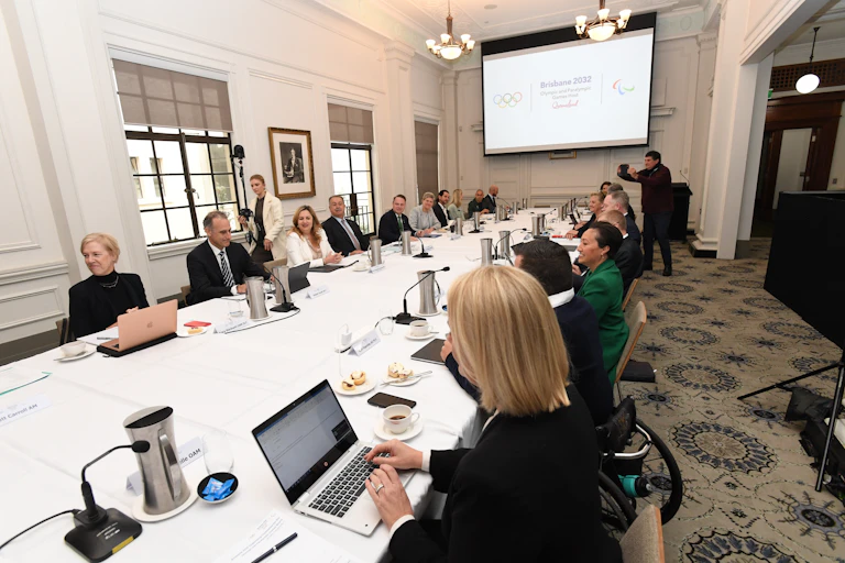 Meeting of people seated at a very long table
