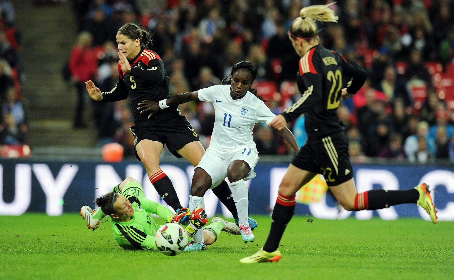 four footballers in play