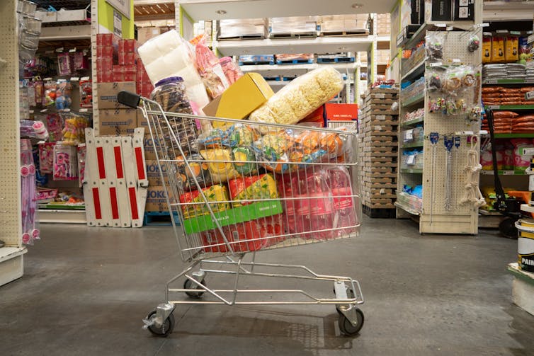 Shopping trolly filled with bulk grocery items