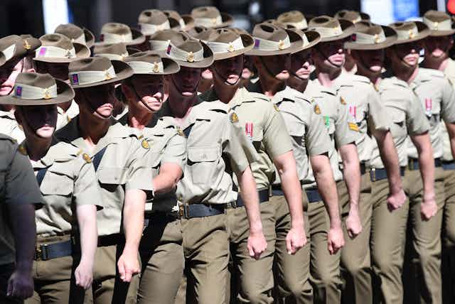 Australian army members marching during an ANZAC Day parade in Brisbane 2021