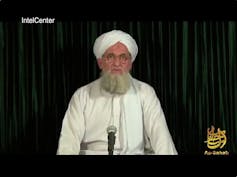 A still from a video shows the bearded former al-Qaida leader dressed in white address the camera.