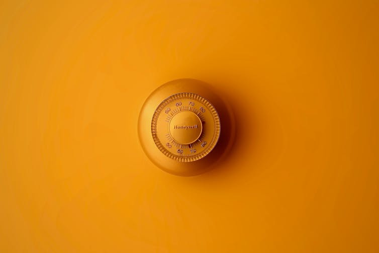 A thermostat on a wall