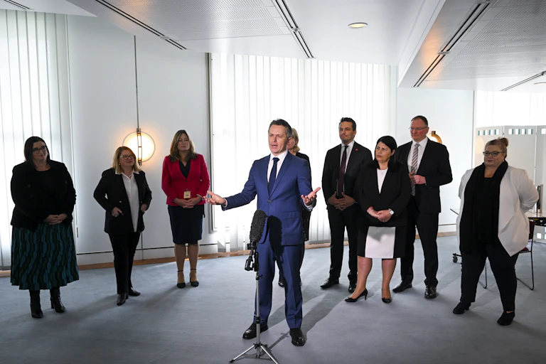 Education Minsiter Jason Clare and state education ministers at a press conference.
