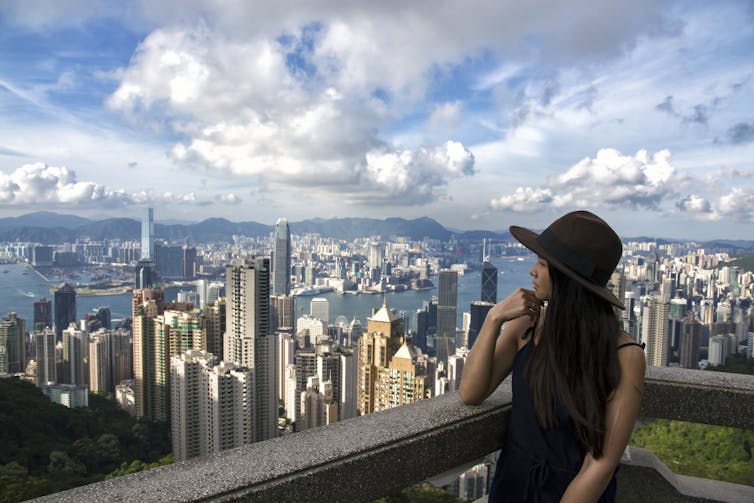 Woman looking out over Hong Kong.
