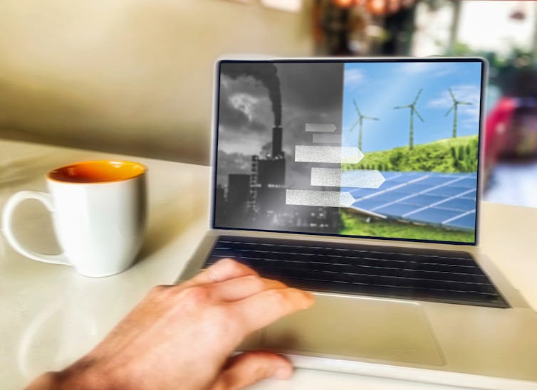 Laptop with image depicting transition from fossil fuels to renewable energy.