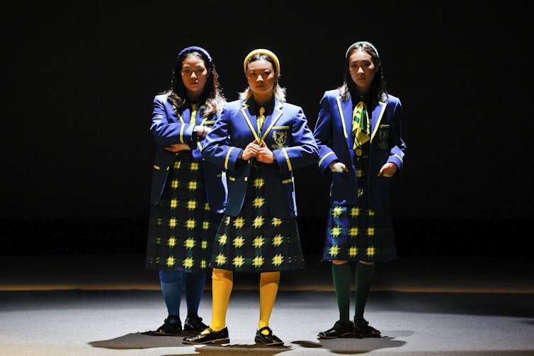 Three girls in school uniforms
